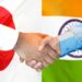 Japan India partnership handshake with national flags representing technology cooperation and investment collaboration