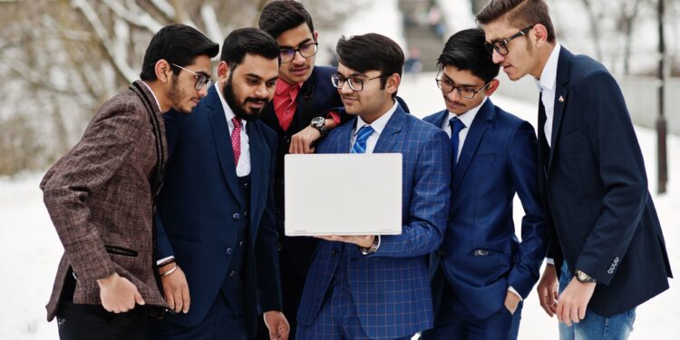 Young Indian businessmen analyzing GDP forecast and investment returns with currency symbols india economy