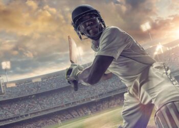 Cricket league match with packed stadium showing India's sports business economics and entertainment industry