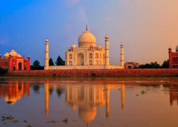 Heritage tourism at Taj Mahal showing cultural site economics and visitor revenue in India