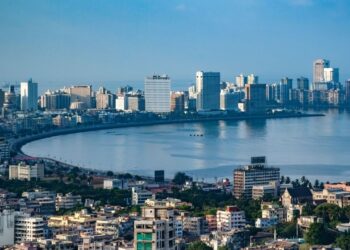 India economy outlook represented by modern business district showing growth sectors and investment opportunities