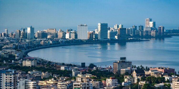 India economy outlook represented by modern business district showing growth sectors and investment opportunities