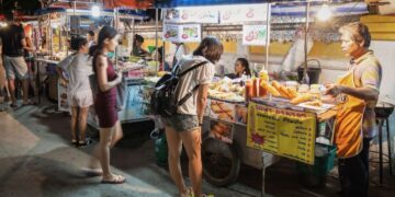 Busy street food stalls in Chandni Chowk Old Delhi one of India's most famous destinations for food travellers