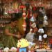Busy festive market in India during Eid al-Adha with shoppers purchasing clothing and food for the celebration
