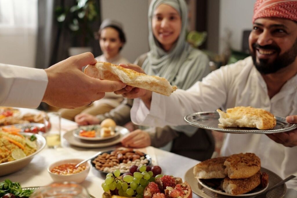 Indian family gathering for a festive meal during Eid al-Adha reflecting community and consumer traditions
