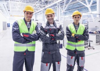 Workers on a manufacturing production line in India under Make in India initiative