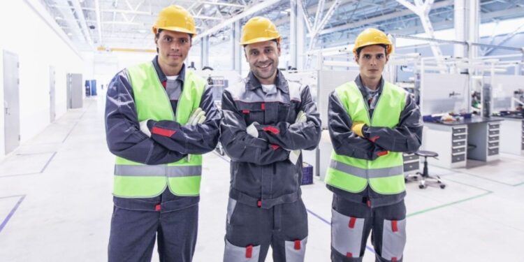 Workers on a manufacturing production line in India under Make in India initiative