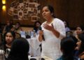 A young Indian woman founder speaks in a conference about building her D2C brand from home in India