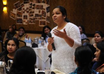 A young Indian woman founder speaks in a conference about building her D2C brand from home in India