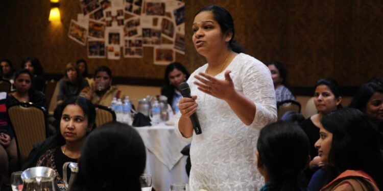 A young Indian woman founder speaks in a conference about building her D2C brand from home in India