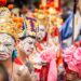 A monk in an ornate mask performs during Hemis Festival in the monastery courtyard in Ladakh