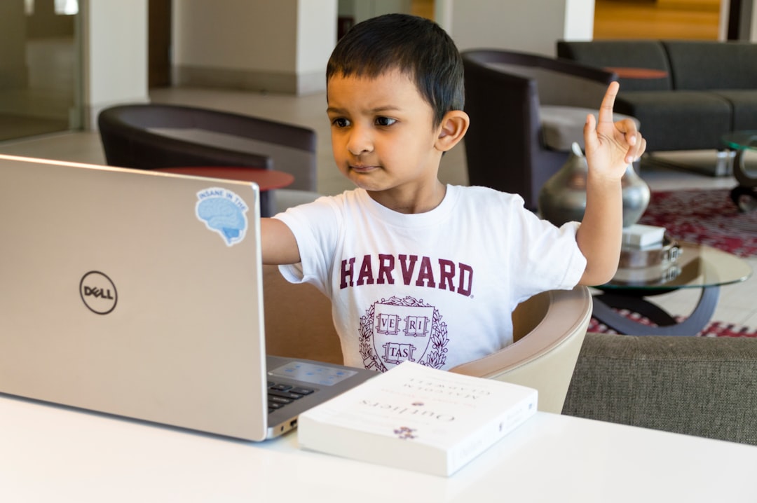 A smiling Indian boy holding an Indian mythology book in a school library