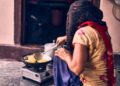 A woman prepares a traditional ragi dosa, one of the most popular naturally gluten-free breakfast dishes.
