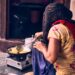 A woman prepares a traditional ragi dosa, one of the most popular naturally gluten-free breakfast dishes.