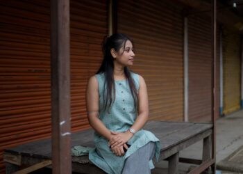 AIndian woman in a breathable linen kurta demonstrates why ethical fabrics are best choice for India's humid monsoon season.