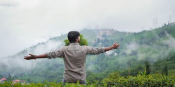 woman-hiking-misty-kerala-tea-garden-pexels - INDIAwebzine A traveler walking through misty tea plantations in Kerala during India monsoon season