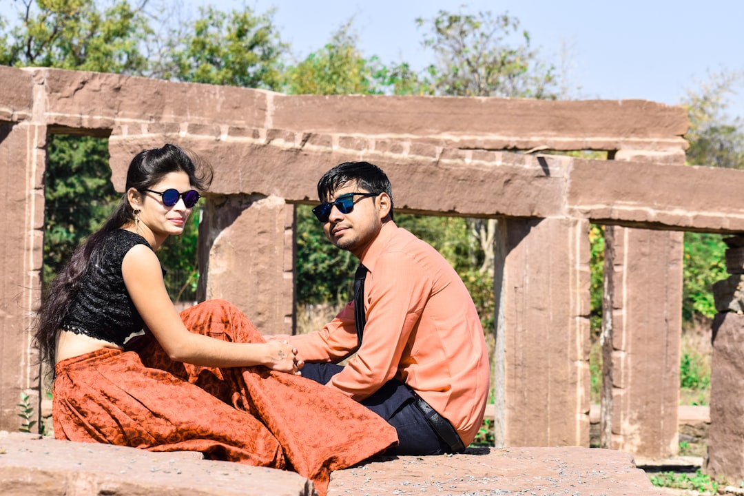 A young Indian couple reviews their index funds SIP plan together on a laptop at home