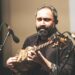 A sitar player records for his independent digital label in a home studio in India