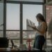 indian-woman-investor-reviewing-financial-documents-unsplash - INDIAwebzine A focused Indian professional woman reviewing her NPS tier II account investment documents at a desk