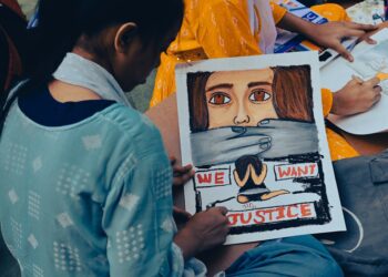 Young Cockroach Janta Party supporters hold signs at a protest in New Delhi demanding exam reform