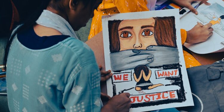 Young Cockroach Janta Party supporters hold signs at a protest in New Delhi demanding exam reform