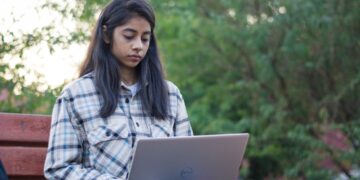 young-indian-woman-studying-laptop-unsplash - INDIAwebzine A young Indian woman studies on her laptop, representing India's demographic dividend generation preparing for the future.