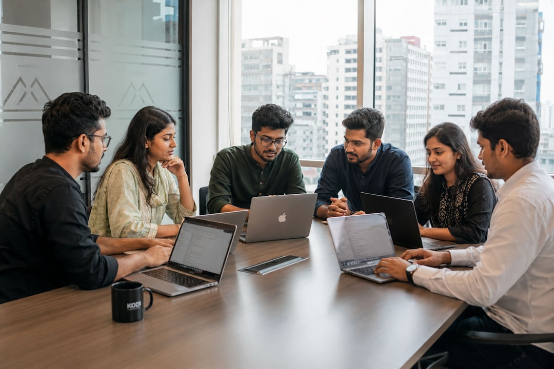 A startup team discussing product strategy, reflecting how bootstrapped businesses grow through collaboration and execution