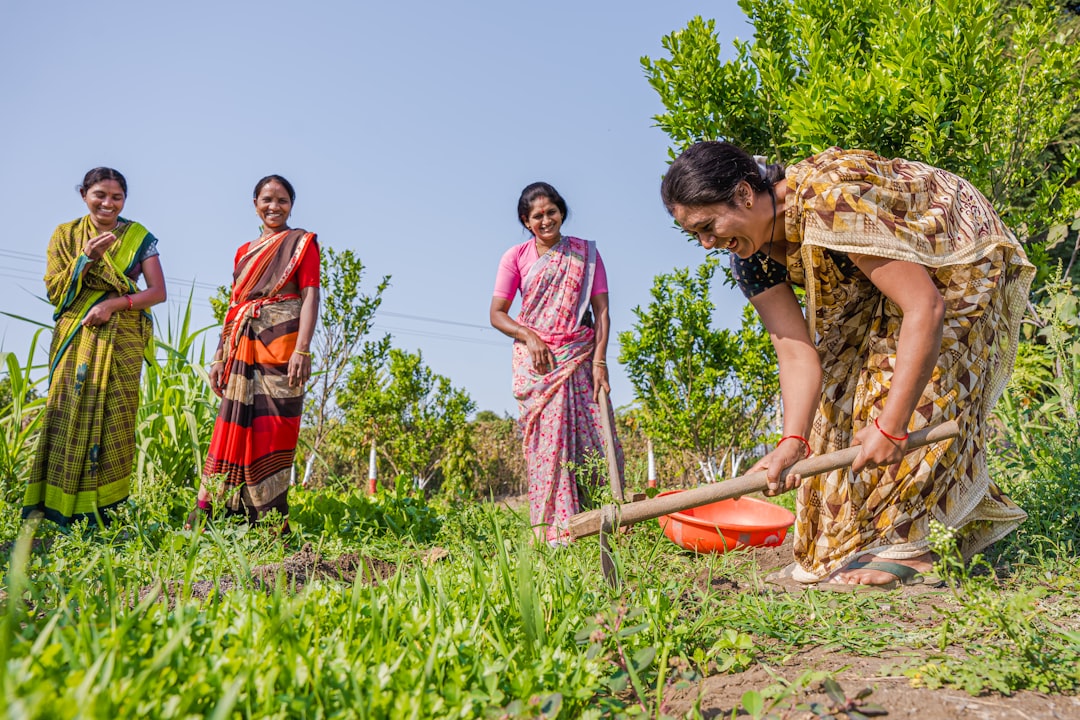 An Indian family sorting vegetable peels into a compost bin at home as part of their zero waste daily routine.