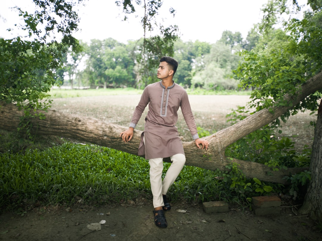 A man dressed in a light linen kurta, showing how festive fashion choices in natural fabrics keep wearers cool