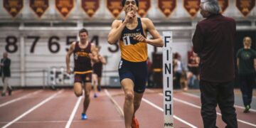 indian-runner-indoor-track-unsplash - INDIAwebzine A young Indian athlete running on an indoor track during monsoon training, focused and in full stride