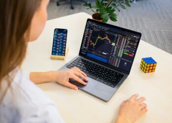 A focused Indian woman reviews her equity portfolio on a laptop before the festive season rally begins