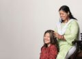 indian-woman-scalp-oil-massage-unsplash - INDIAwebzine A woman performing a traditional scalp care oil massage on her long dark Indian hair at home
