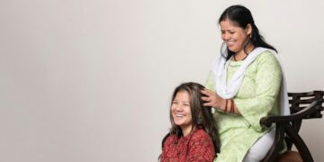 indian-woman-scalp-oil-massage-unsplash - INDIAwebzine A woman performing a traditional scalp care oil massage on her long dark Indian hair at home