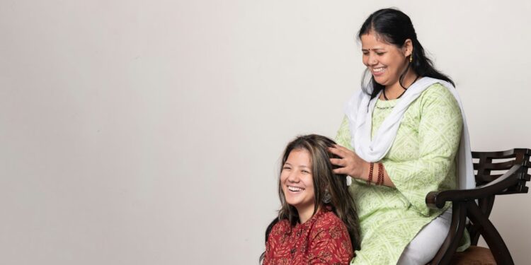 indian-woman-scalp-oil-massage-unsplash - INDIAwebzine A woman performing a traditional scalp care oil massage on her long dark Indian hair at home