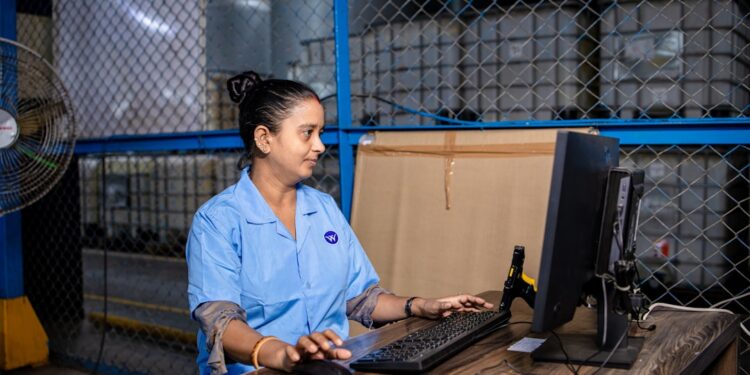 indian-woman-seller-checking-warehouse-inventory-unsplash - INDIAwebzine A woman seller reviewing festive procurement stock in a warehouse in India