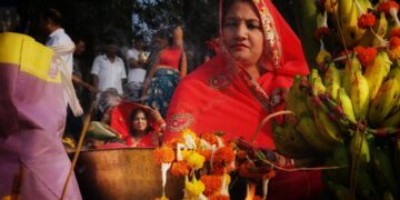 woman-devotee-midnight-temple-india-unsplash - INDIAwebzine A woman devotee taking part in Janmashtami celebrations at a lit temple in Mathura at midnight