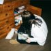 woman-organizing-shelves-home-unsplash - INDIAwebzine A woman arranges items on vertical wall shelves as part of a small-space storage solution in her Indian home
