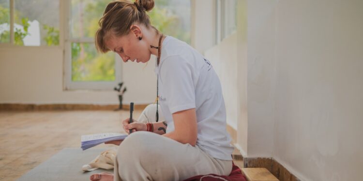 woman-yoga-bolster-indoor-india-unsplash - INDIAwebzine A woman practicing restorative yoga on a bolster at home during the post-monsoon season in India