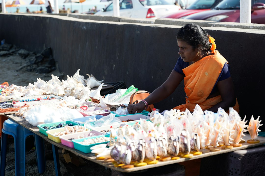 A craftsman carefully packages handmade products for craft export, combining traditional skill with modern logistics
