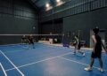 An Indian badminton player practices footwork drills on an indoor court during the September preparation phase.