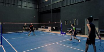 badminton-training-indoors-unsplash - INDIAwebzine An Indian badminton player practices footwork drills on an indoor court during the September preparation phase.