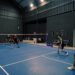 badminton-training-indoors-unsplash - INDIAwebzine An Indian badminton player practices footwork drills on an indoor court during the September preparation phase.