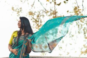 A woman draping a handloom saree at home as part of her festive reset before the celebration season in India