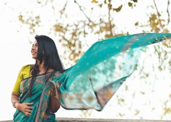 A woman draping a handloom saree at home as part of her festive reset before the celebration season in India