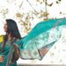 A woman draping a handloom saree at home as part of her festive reset before the celebration season in India