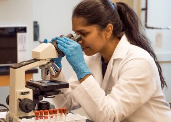 An Indian-origin woman scientist reviews data in a NASA laboratory, representing the growing role of Indian scientists.
