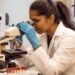 An Indian-origin woman scientist reviews data in a NASA laboratory, representing the growing role of Indian scientists.