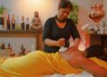 indian-woman-self-massage-oil-unsplash - INDIAwebzine A woman performing Abhyanga self-massage with warm herbal oil as part of her Ayurvedic detox ritual before the festive season