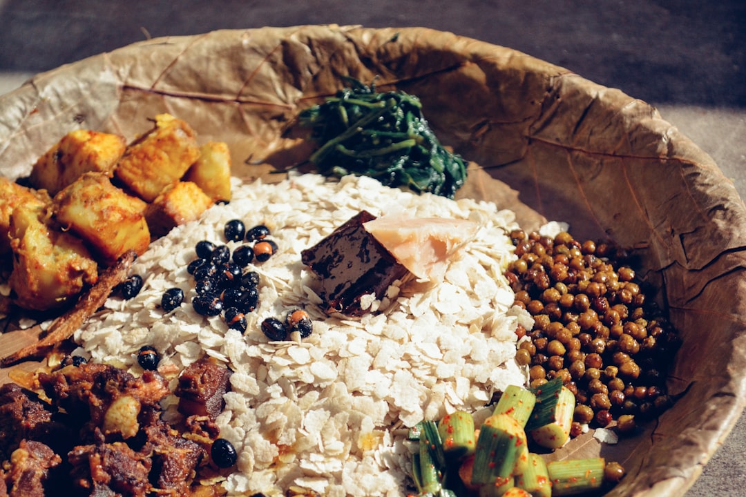 A group of guests share a traditional Onam Sadya meal together at a heritage property among the best Kerala retreats.