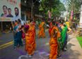 Women in an embroidered chaniya-choli spins during Navratri celebrations at a community Garba night